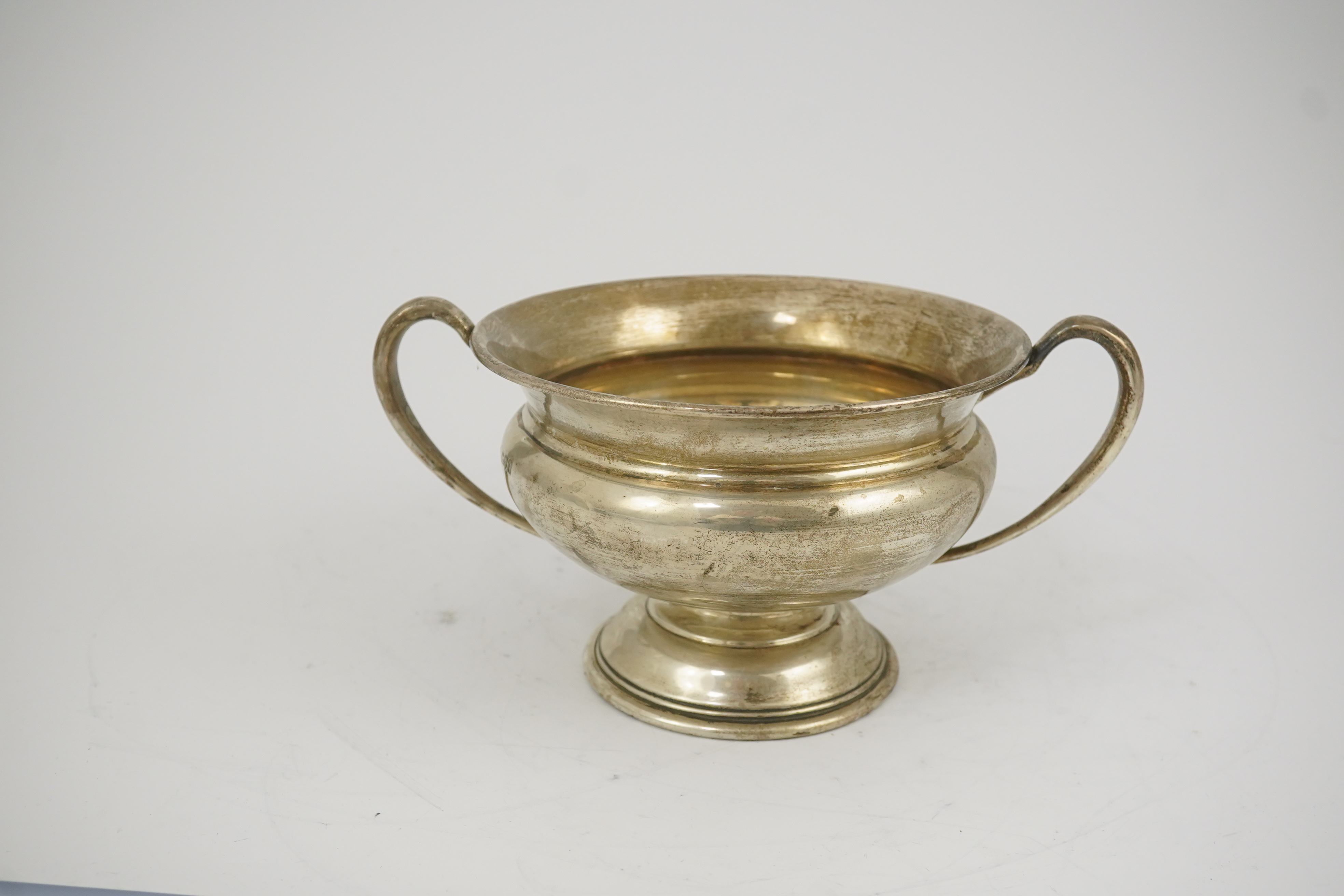 A George V silver two handled pedestal bowl, by Charles Edwards